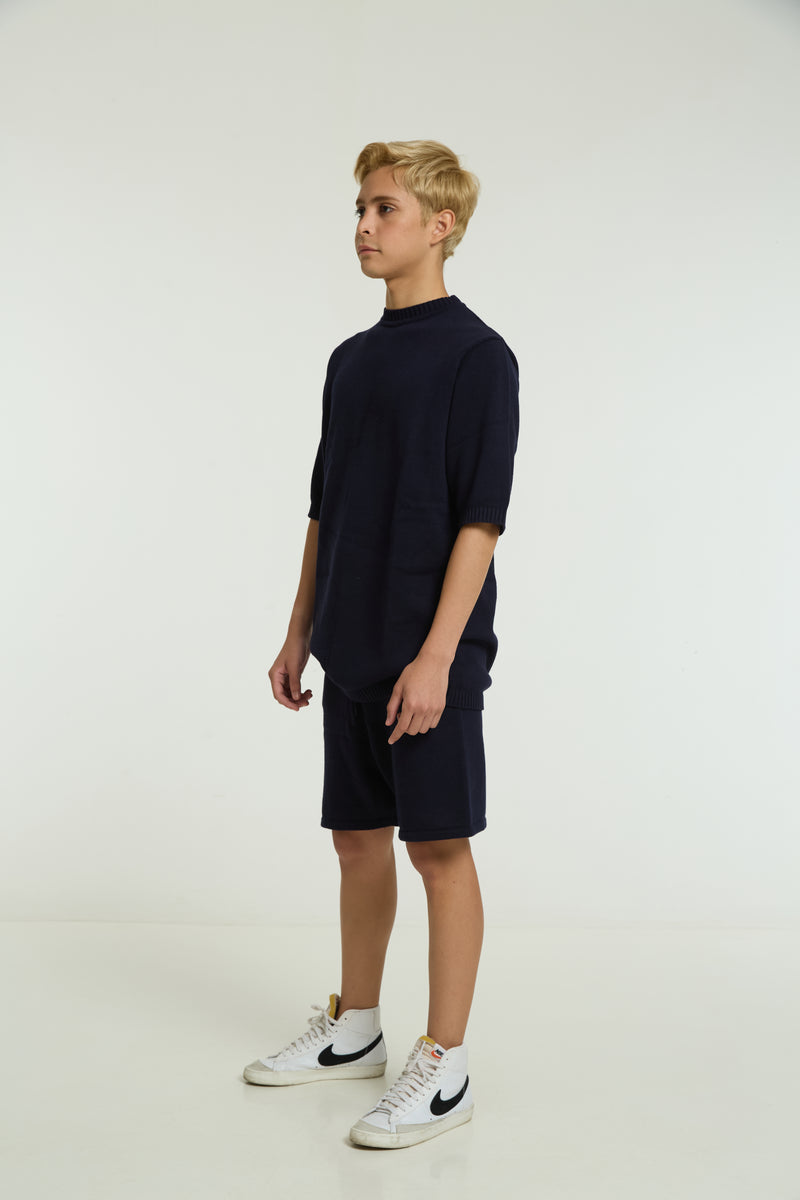 Kids navy cord set, front view, boy wearing sneakers